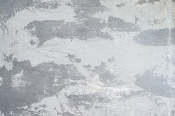 The painted wall is light to dark in grayscale gradients. Background