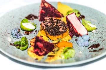 Mushroom stuffed with lentils with pork belly. The food in the restaurant. Food styling and restaurant meal serving.