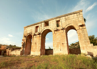 Fototapeta na wymiar The ancient Roman gate at the northern edge of the ruins of Patara, Turkey 