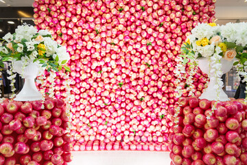 Beautiful photo zone, wedding, event background for a photo with red apples and flowers