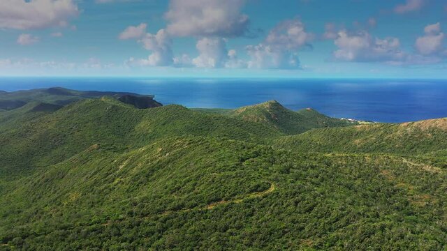 Aerial view above scenery of Curacao, Caribbean with ocean, coast, mountains