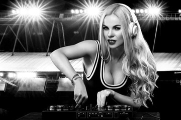 Balck and white portrait of sexy DJ with record deck playing music and listen sound on red...
