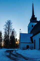 Beautiful white church of Valkeala in winter sunset, Kouvola, Finland