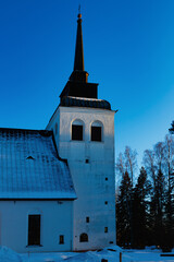 Beautiful white church of Valkeala in winter sunset, Kouvola, Finland