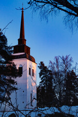 Beautiful white church of Valkeala in winter sunset, Kouvola, Finland