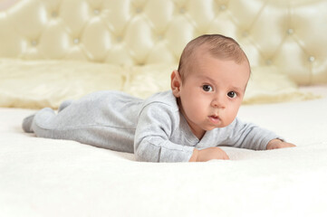 cute little baby boy  on bed