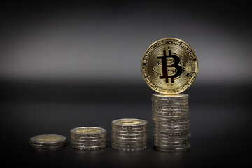 a golden Bitcoin on some Euro coins