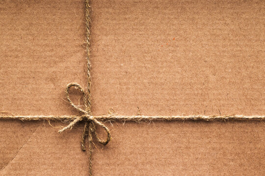 Cardboard box tied with coarse rope