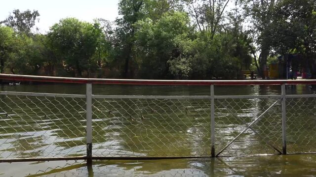 A view of canal in ayub park with safety stand board.