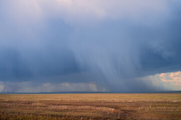 Obraz na płótnie Canvas Very heavy rain over dry steppe in Kazakhstan.