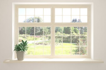 Fototapeta premium White empty room with summer landscape in window. Scandinavian interior design. 3D illustration
