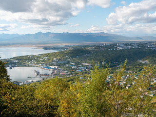 View of the city of Petropavlovsk-Kamchatsky and the sea bay from Mishennaya Sopka. Magnificent aerial view of the city and volcanoes. Kamchatka Peninsula, Russia.