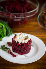 dietary salad of boiled beets with walnuts and cottage cheese