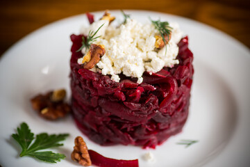 dietary salad of boiled beets with walnuts and cottage cheese
