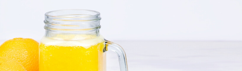 Banner Orange juice isolated on a white background.A glass of orange juice. Healthy food. Vegan food