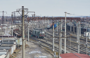 Fototapeta na wymiar View of the railway tracks. Old Soviet locomotive. Kiev, Ukraine.