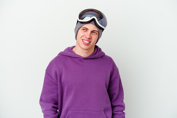 Young man holding a snowboard board isolated on white background looks aside smiling, cheerful and pleasant.