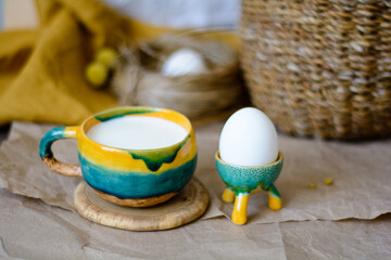 Hand made ceramic craft ware. Cup of milk and egg stand.