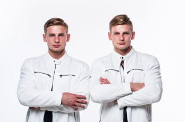 Fototapeta premium twin brothers men in white casual clothes look alike, male fashion