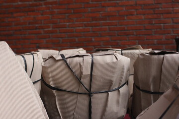 Obraz na płótnie Canvas Brick wall texture and wrapped chair
