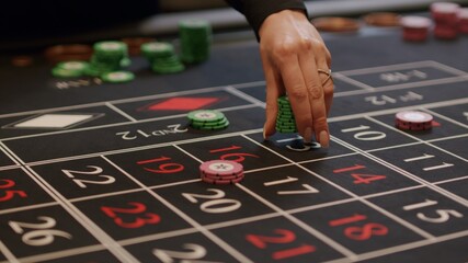player placing bets at casino