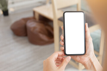 cell phone blank white screen mockup.woman hand holding texting using mobile on desk at office.background empty space for advertise.work people contact marketing business,technology