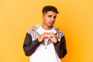 Young african american curly man isolated on purple making up plan in mind, setting up an idea.