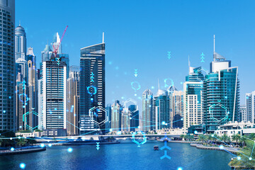 Skyscrapers of Dubai business downtown. International hub of trading and financial services. Technology theme icons hologram, concept of big data. Double exposure. Dubai Canal waterfront.