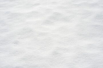 Fresh clean white snow background texture. Winter background with frozen snowflakes and snow mounds. Snow lumps. Seasonal landscape details. Cold weather.