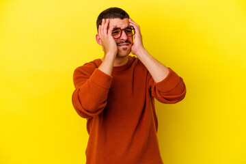 Young caucasian cool man isolated on yellow background whining and crying disconsolately.