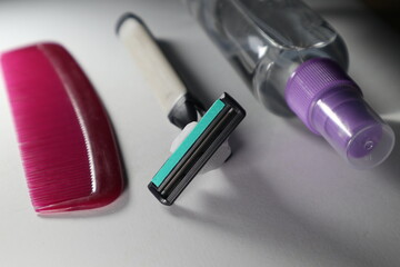 macro photo  package barber tools. spray comb and blade razor on white isolated