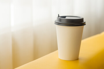 Paper cup for coffee, tea with an empty space for logo.