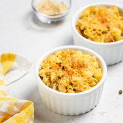 Creamy rich cheesy crust macaroni and cheese in backing dish.Space for text.