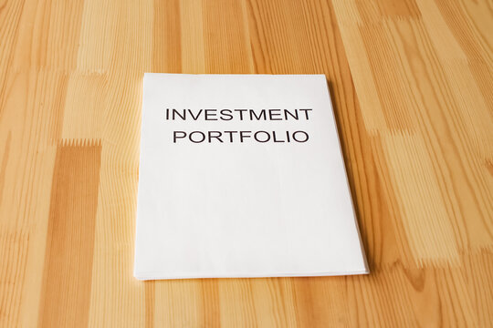 Empty space for text or logo. Investment portfolio on the table.