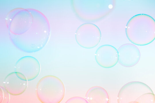 Beautiful transparent colorful soap bubbles floating background.