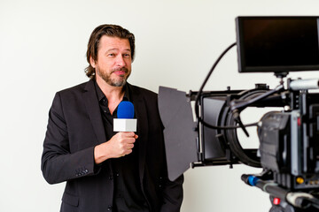 Middle age reporter man with a microhpone