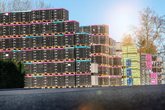 Marbach, Germany-March 12.2021:car parts lie in transport boxes that are stacked on top of each other on euro pallets