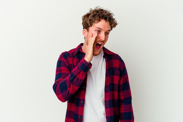 Young caucasian man isolated on white background shouting excited to front.