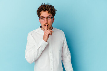 Young caucasian business man isolated on blue background keeping a secret or asking for silence.