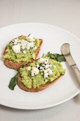 Avocado toast. Sliced bread with avocado.