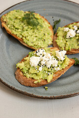 Avocado toast. Sliced bread with avocado.