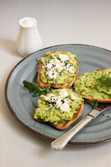 Avocado toast. Sliced bread with avocado.
