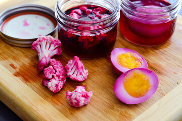 Obraz na płótnie Canvas Colorful vegetables and hard boiled eggs purple Easter Spring Jar DIY