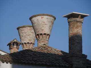 Chioggia, typical ancient chimney on the roof of the building along Vena Canal