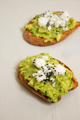 Avocado toast. Sliced bread with avocado.