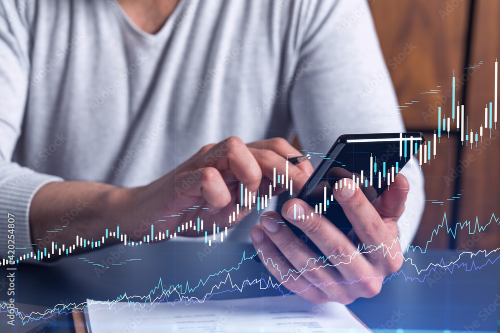 Poster trader holding in the hands a smart phone and researching stock market to proceed right investment s