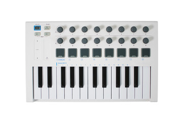 White midi keyboard with knobs and pads