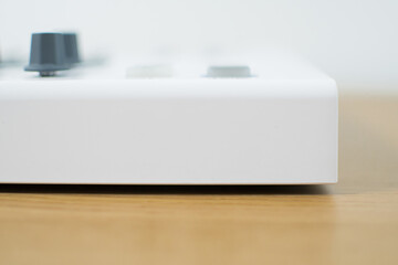 White midi keyboard with knobs and pads