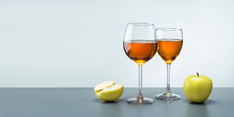 Two Glasses Of Apple Juice On Grey Light Background With Copy Space.