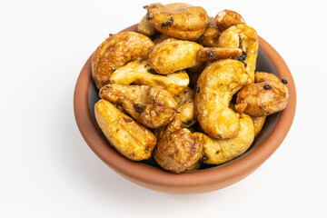 roasted cashew nuts with black truffle - tuber aestivum - in a bowl